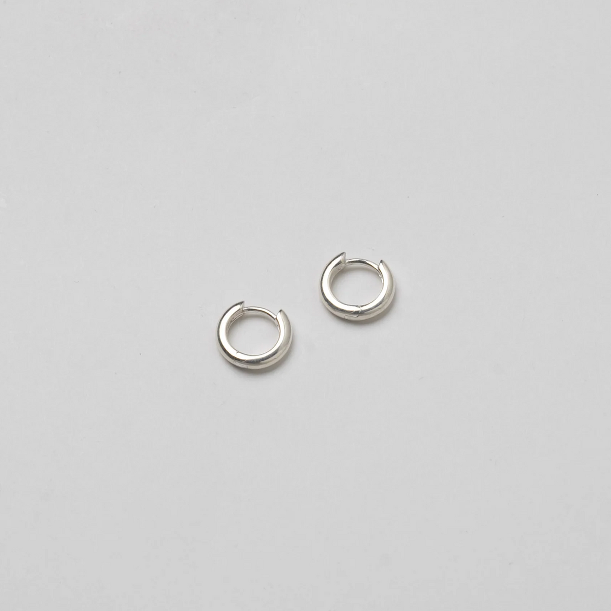 CLASSIC HUGGIE SILVER HOOP EARRINGS